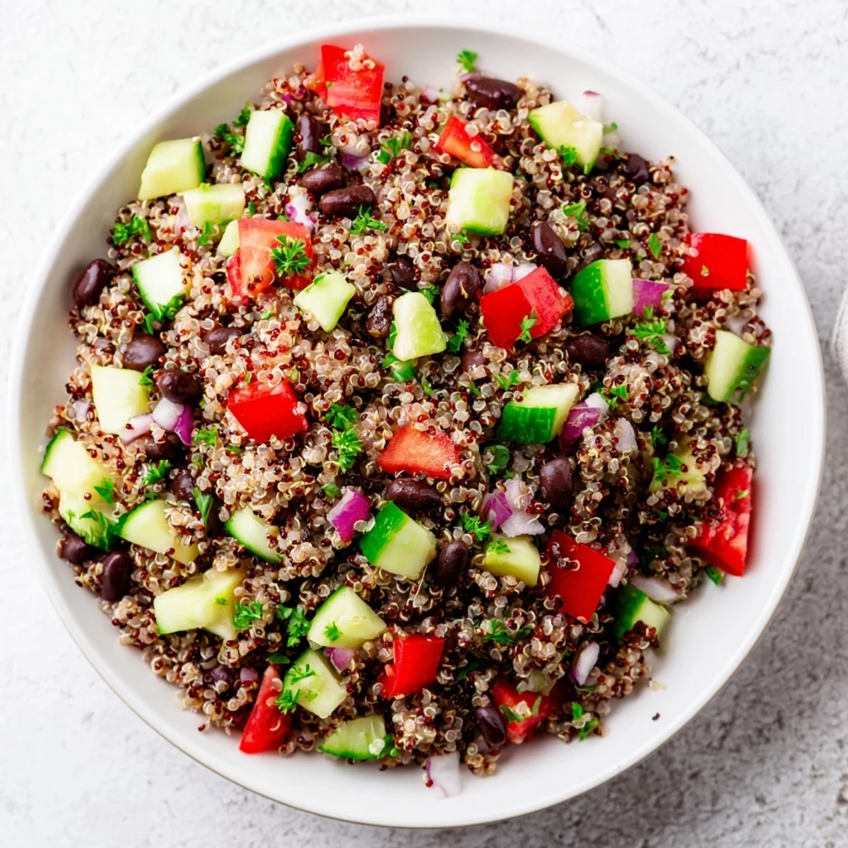 Fresh, colorful quinoa and black bean salad, tossed with lime dressing and cilantro.
