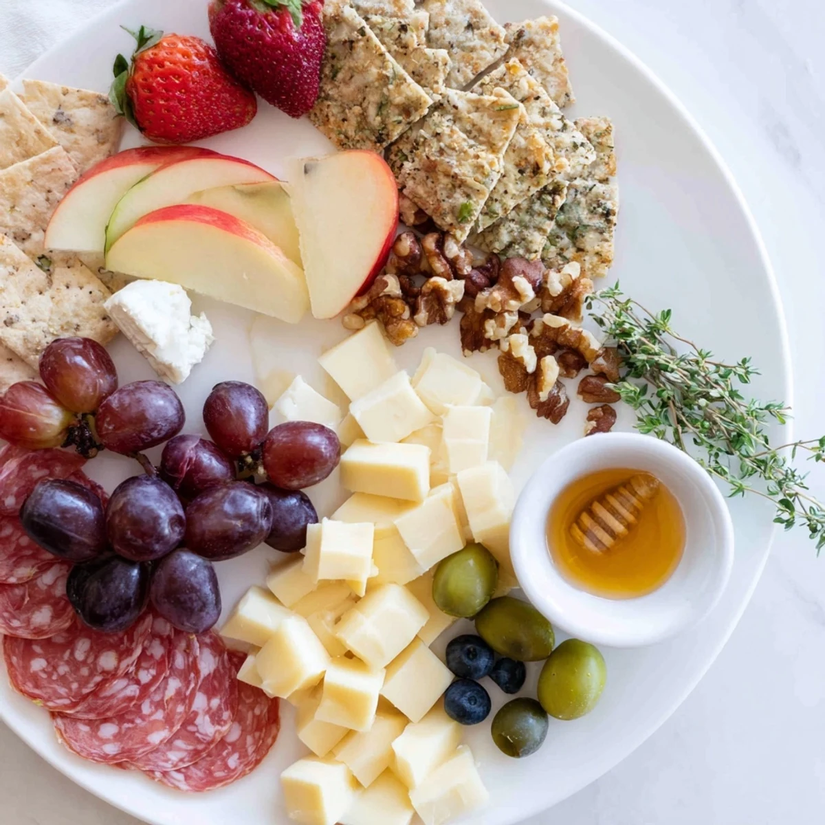 Quick charcuterie snack board with colorful fruit, cheeses, and meats, ready for a relaxed girl dinner.