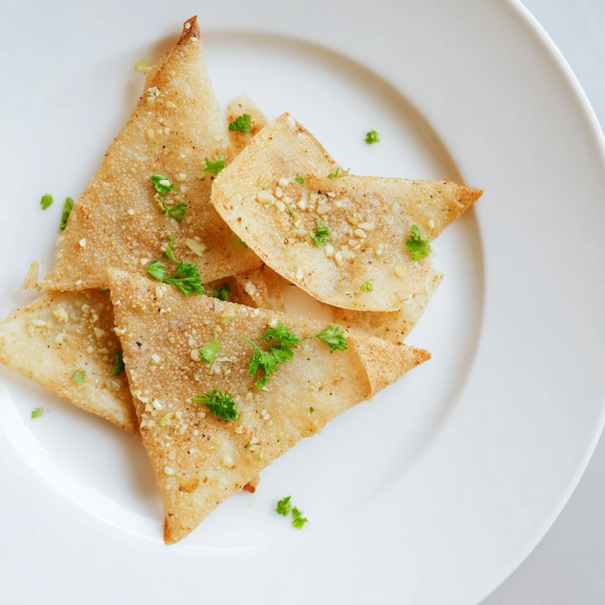 Golden, crispy garlic lumpia chips ready to serve, a perfect crunchy snack or appetizer.