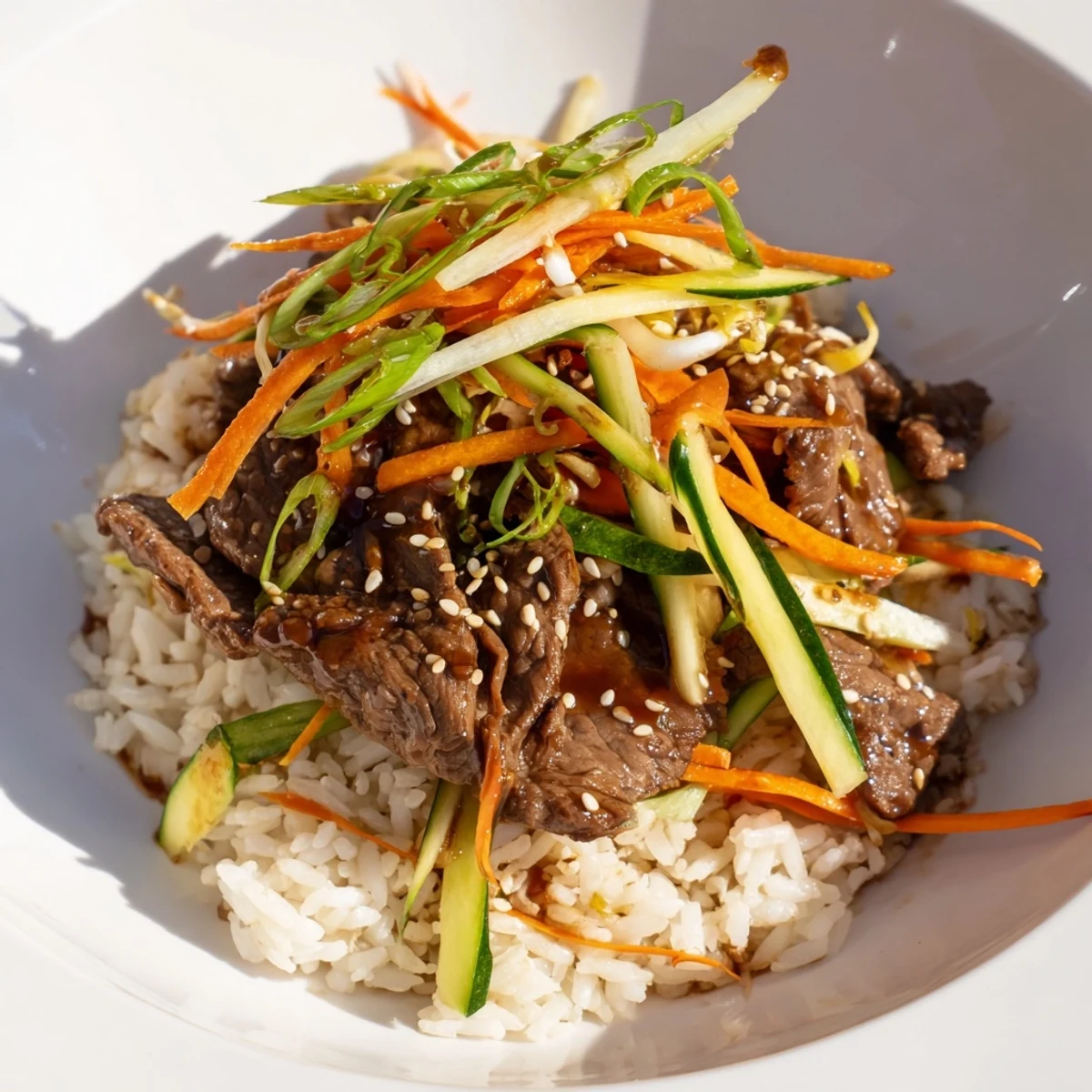 Savory bulgogi beef bowl with glistening marinated beef and colorful, crisp vegetables.