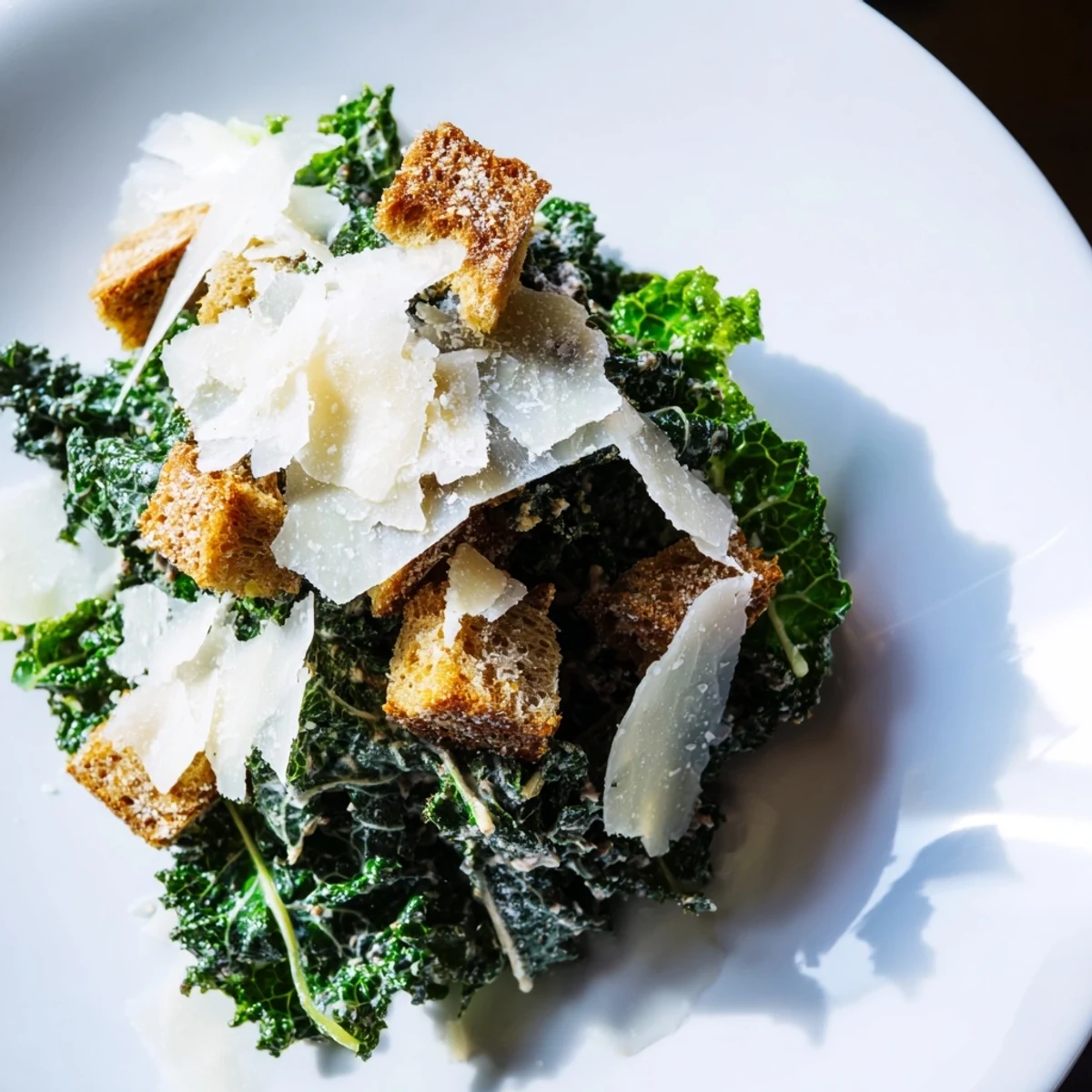 Fresh and vibrant Kale Caesar Salad features massaged kale, creamy dressing, crunchy croutons, and Parmesan.