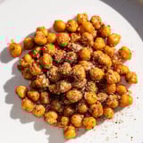 A close-up of crunchy, oven-roasted chickpea snack, a delicious vegan protein-packed treat.