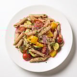 Mediterranean lentil pasta showcases wholesome whole wheat pasta mixed with colorful roasted vegetables and lentils.