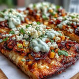 Street Corn Flatbread, perfectly charred, drizzled with zesty jalapeño crema for easy entertaining.