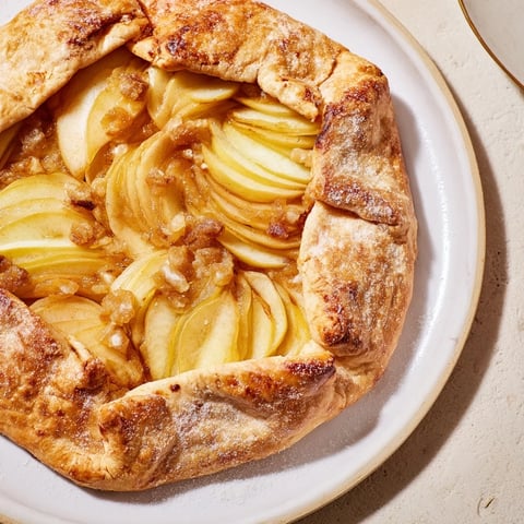 Golden, flaky Rustic Pear and Ginger Galette shows off tender pears baked inside a buttery crust.