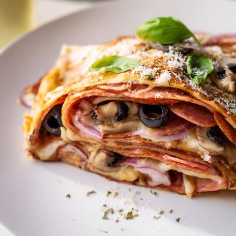 Golden-brown, crispy Cheesy Tortilla Pizza Wrap, filled with melty cheese and savory pizza flavors.