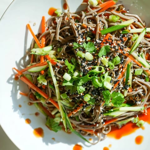 Vibrant Chilled Noodle Lunch Cups with fresh cucumber and carrots offer a cool, flavorful meal.