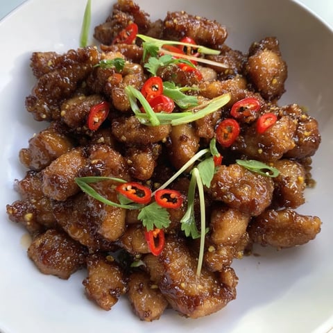 Vietnamese Caramel Chicken with glossy sauce, garnished with fresh cilantro, ready to serve over rice.