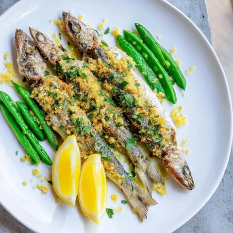 Sheet Pan Lemon Herb Tilapia and Green Beans: golden, flaky fish with bright lemon and roasted green beans.