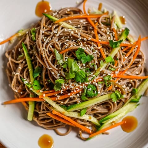 Sesame-infused Chilled Noodle Lunch Cups, featuring perfectly chilled noodles and colorful vegetables, look appetizing.