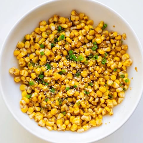 Golden Japanese Butter Corn with glistening kernels in a buttery, savory sauce.