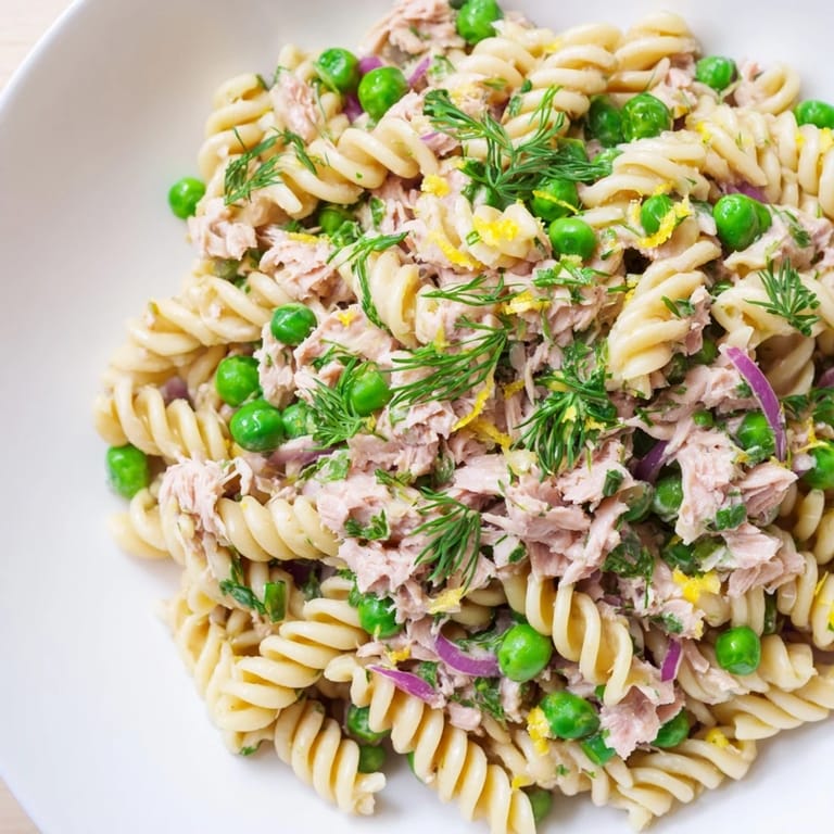 Serving suggestion for Lemony Tuna Pasta Salad, featuring tender tuna flakes and bright herbs perfect for a light lunch.