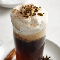 Iced chai with cold foam, a creamy, spiced beverage, perfect for summer afternoons.
